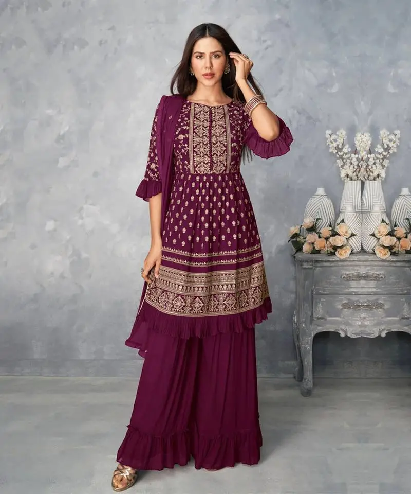 women in wine color sharara suit set