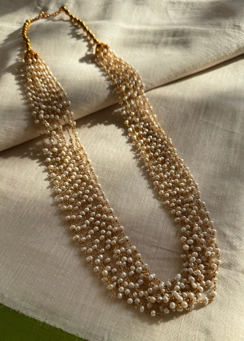 Layered pearl and gold beaded necklace with multiple strands, elegant new top jewelry for festive and wedding wear