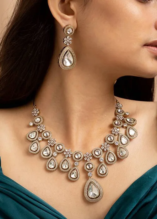Regal kundan necklace set with teardrop stones and matching earrings in gold finish, traditional new top jewelry design