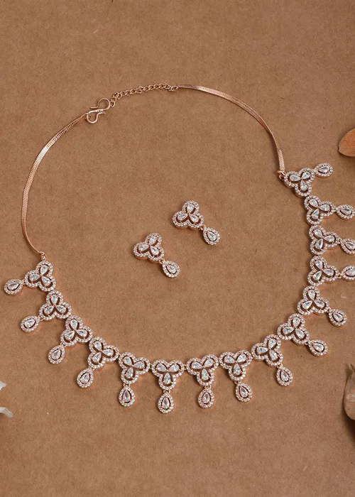 Rose gold crystal drop necklace set with matching earrings featuring delicate teardrop motifs, modern new top jewelry for evening wear