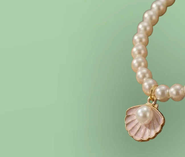image contain imitation pearl jewellery